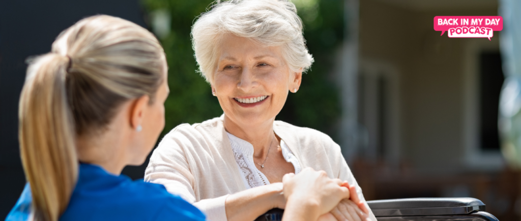 resident with nurse in wheel chair